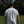 Person wearing a 'Backyard Golf Tour' shirt on a golf course